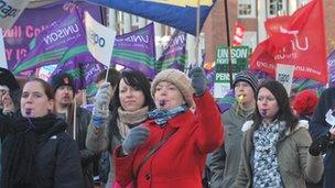 Women blowing whistles