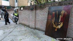 A royal portrait is dumped outside the British embassy in Tehran, 29 November 2011