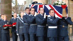 Members of the RAF carry the coffin into Coventry Cathedral