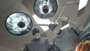 Surgeons operating