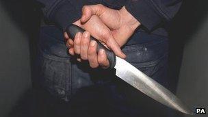 A man holding a knife