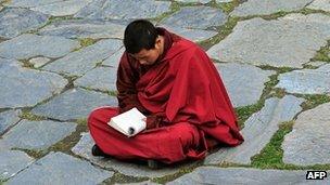 A monk meditates at a monastery in Sichuan province on 23 March 2008