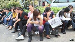 Bra factory workers out on strike in Shenzhen on 16 November 2011