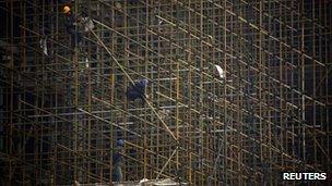 Workers on scaffolding in Beijing