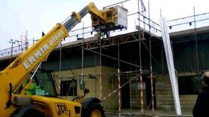 Mechanical vehicle lifting solar panels