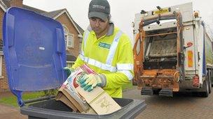 Man using recycling bins