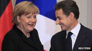 German Chancellor Angela Merkel and French President Nicolas Sarkozy after talks in Paris (5 Dec 2011)