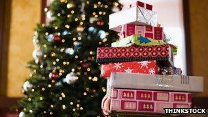 Child holding Christmas presents