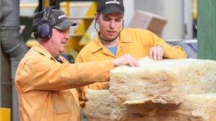 Men inspecting fibreglass