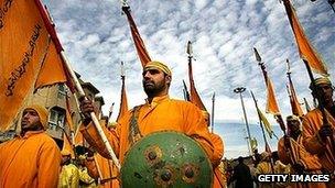 Men in Karbala dressed as troops from the Battle of Karbala