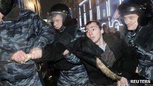 Russian police detain a protester