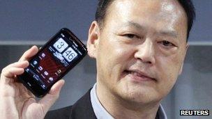 HTC chief executive with smartphone