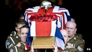 Pallbearers carry Lt David Boyce's coffin