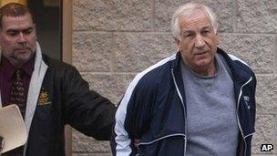 Jerry Sandusky, leaves the office of Centre County District Justice 7 December 2011