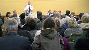 Firefighter standing up addressing public