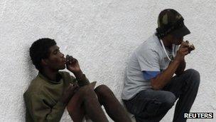 Two men smoke crack cocaine in Sao Paulo