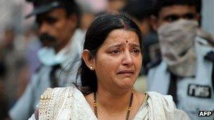 A relative of a patient at the AMRI hospital reacts as a fire engulfed a private hospital in the eastern Indian city of Calcutta.