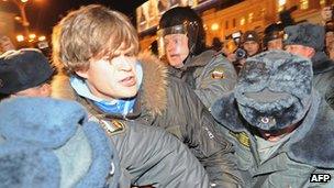 Russian police detain a opposition activist at a protest in Triumfalnaya [Triumphal] Square