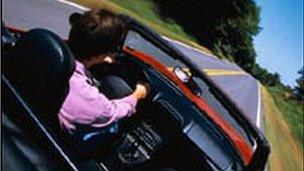 Man driving open top car