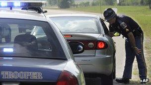 Alabama Department of Public Safety's Sgt. Steve Jarrett talks to a driver he stopped in Montgomery, Ala