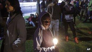 Protesters hold a night vigil as talks at the climate change summit in Durban, South Africa, on 9 December 2011.