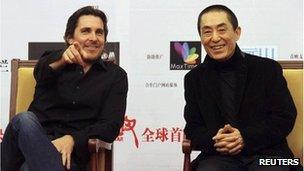 British actor Christian Bale (L) and Chinese director Zhang Yimou attend the premiere of "The Flowers of War" in Beijing December 11, 2011