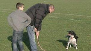 Neil Downing and his son Jack, with their medical alert dog Roots