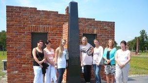 Members of the Priory Project at the Gypsy memorial in Auschwitz