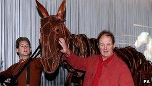 Michael Morpurgo (right) with a War Horse puppet and puppeteer