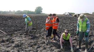Volunteers planting reeds at Besthorpe nature reserve