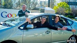 Google's executive team with one of their self-drive cars