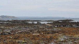 Long sea sewage outfall pipe with Herm and Sark in the background