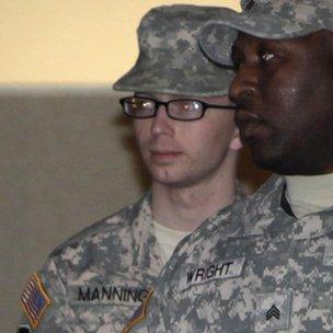 Bradley Manning (L) is escorted from the court at Fort Meade, Maryland, on 16 December 2011