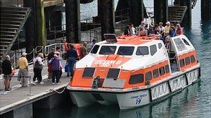 Cruise passengers boarding a tender at the inter-island quay