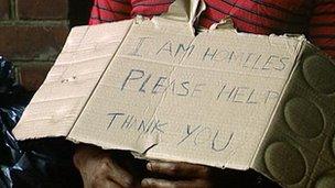 Cardboard sign reading: 'I am homeless please help. Thank you'