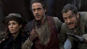 Noomi Rapace, Robert Downey Jr and Jude Law in Sherlock Holmes: A Game Of Shadows