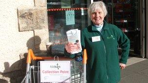 A North Lakes Foodbank volunteer raises publicity about the scheme