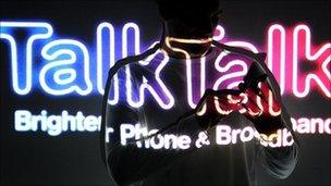 TalkTalk logo with silhouette of person on phone