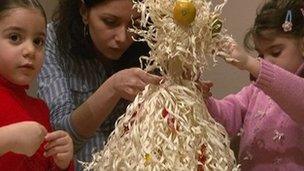 Sophio Phitskhelauri and her children decorating their chichilaki