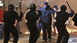 Police confronting protesters in Tottenham in August