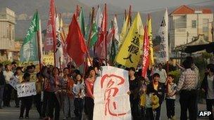 Villagers march in protest in Wukan on 15 December 2012