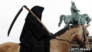 Protestor dressed as one of the Four Horsemen