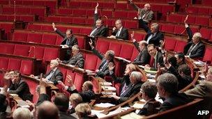 Members of the French National Assembly vote on the genocide bill