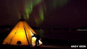 Tent with aurora visible