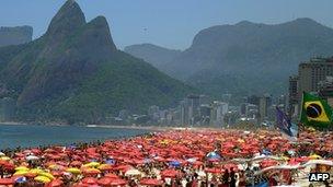 Thousands of people crowd Ipanema Beach in Rio de Janeiro, Brazil, on 22 December 2011