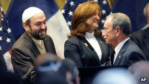 New York Mayor Michael Bloomberg (right) shakes hands with an imam at the interfaith breakfast on 30 December 2011