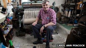 Donald John MacKay sitting in front of his loom