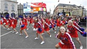 Marching bands and cheerleader troupes at Piccadilly Circus