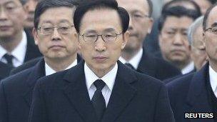 Lee Myung-bak (centre) pictured at the National Cemetery in Seoul on 1 January 2012
