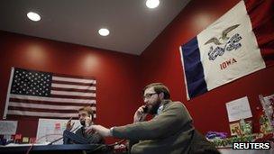 Supporters of US Republican presidential candidate Ron Paul telephone potential voters from Ankeny, Iowa, on 1 January 2012